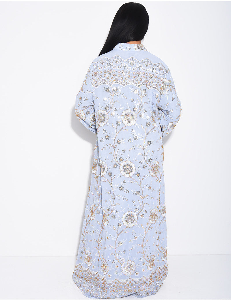 Abaya ample à broderies dorées et pompon