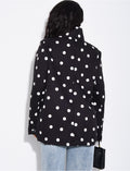 Veste de blazer col montant fendue sur l'avant à pois
