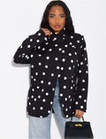 Veste de blazer col montant fendue sur l'avant à pois