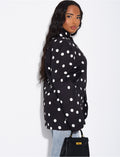 Veste de blazer col montant fendue sur l'avant à pois