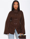 Blouse col montant à attaches qui se noue dans le dos