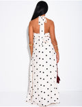 Ensemble à pois jupe longue et crop top dos nu