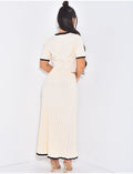 Ensemble gilet court et jupe évasée et plissée