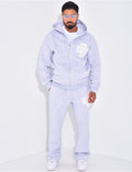 Ensemble pantalon et sweat zippé à motifs