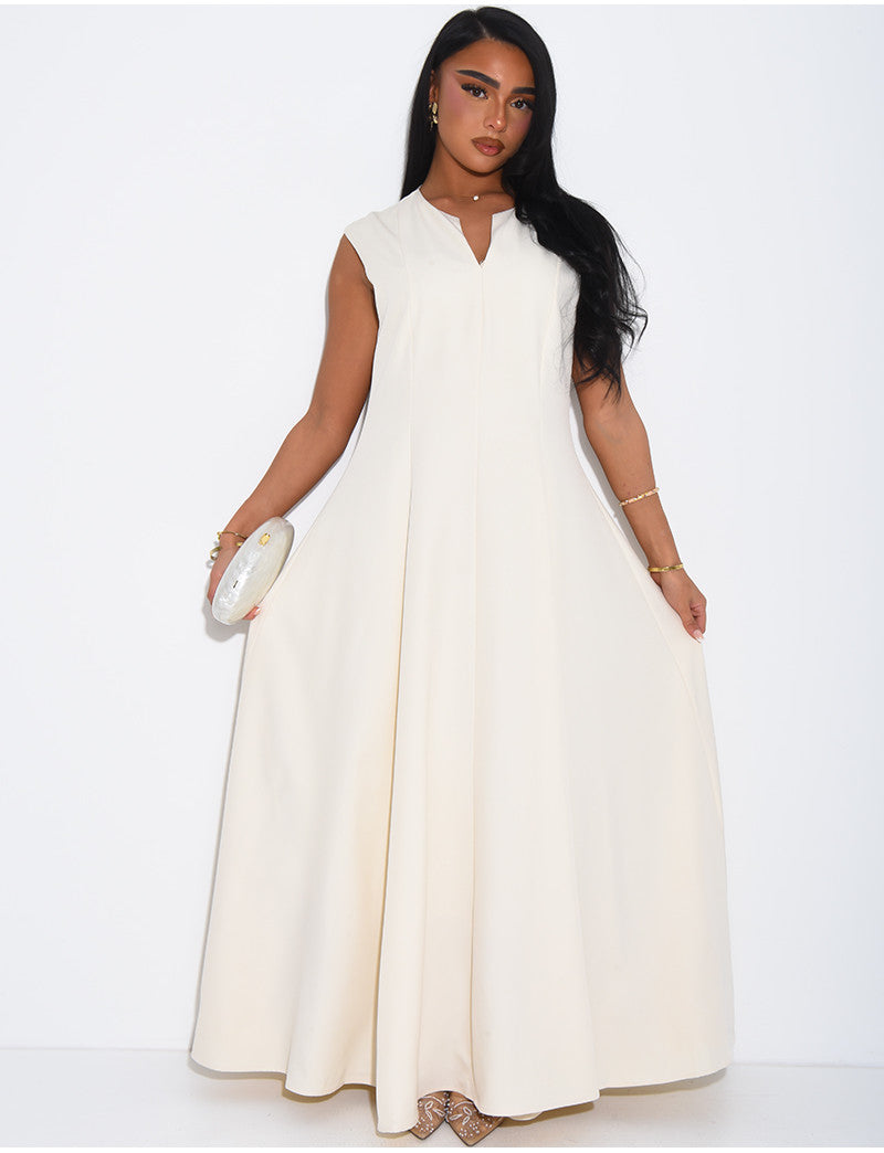 Ensemble robe sans manche évasée et cape plissée à broche