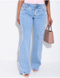 Jeans coupe large taille moyenne à coutures effilochées