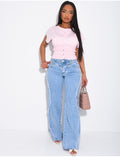Jeans coupe large taille moyenne à coutures effilochées