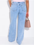 Jeans coupe large taille moyenne à coutures effilochées