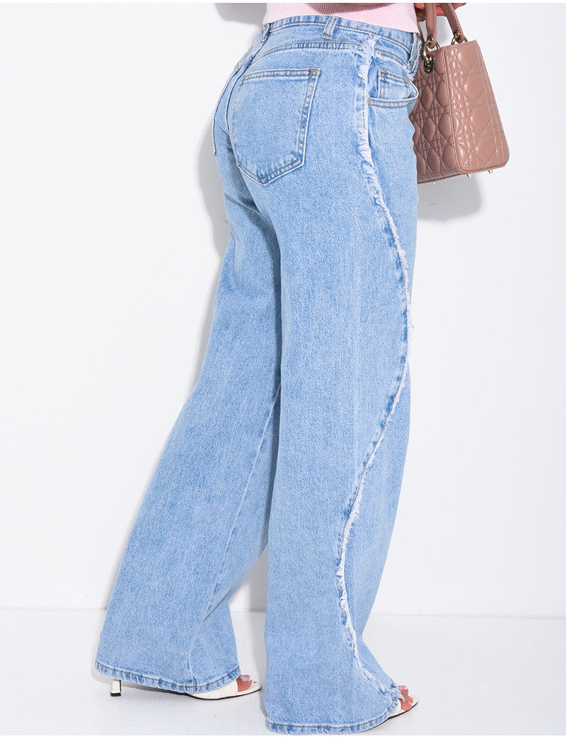 Jeans coupe large taille moyenne à coutures effilochées