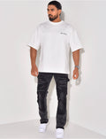 Jeans à empiècements et tâches de peinture