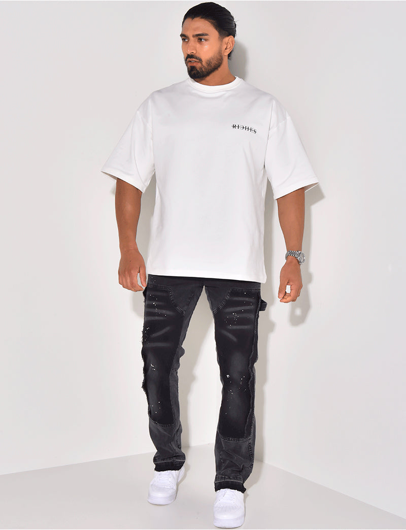 Jeans à empiècements et tâches de peinture