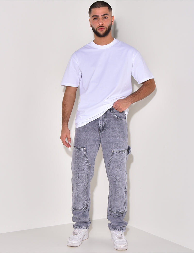 Jeans avec empiècements à motifs en relief