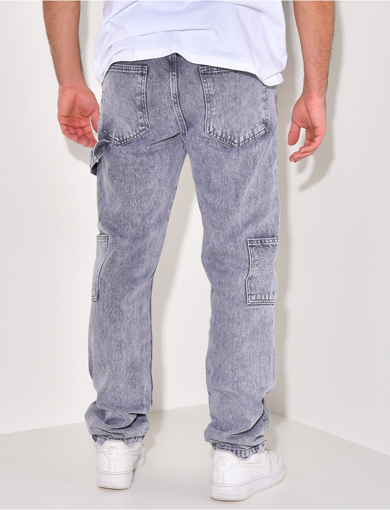 Jeans avec empiècements à motifs en relief