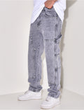 Jeans avec empiècements à motifs en relief