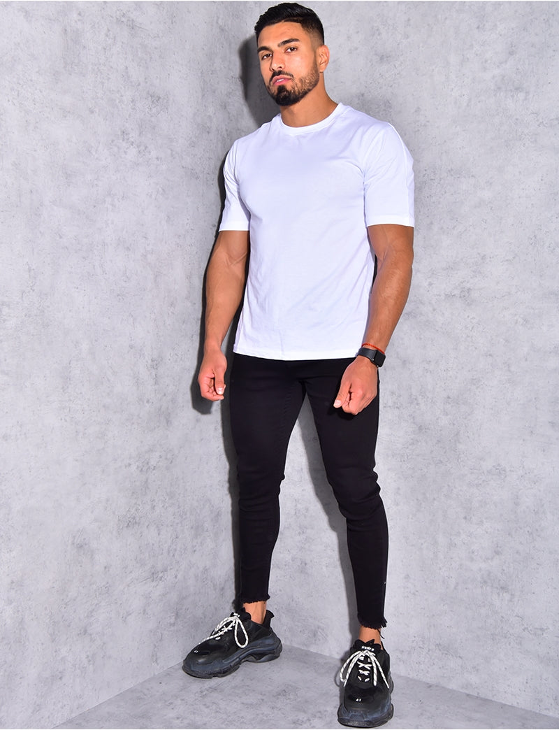 Jeans basic effiloché aux chevilles