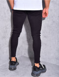 Jeans basic effiloché aux chevilles