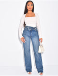 Jeans coupe droite stretchy à boutonnière croisée