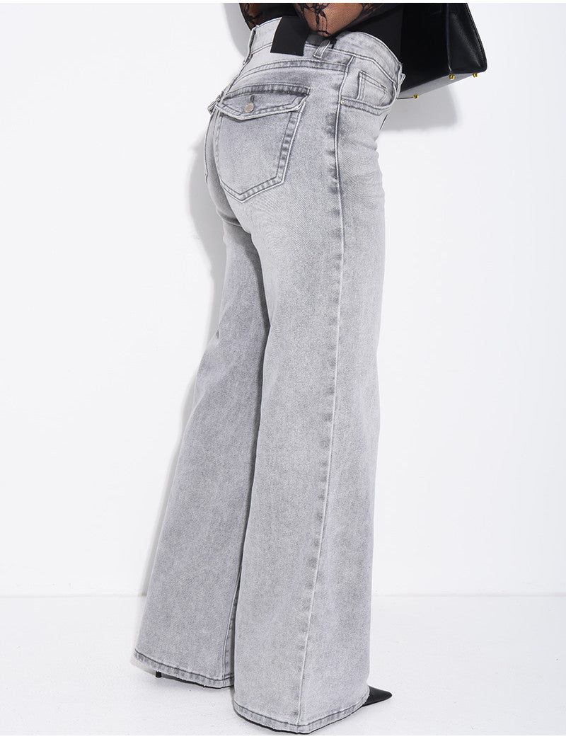 Jeans taille basse wide leg à poches rabattues