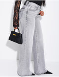 Jeans taille basse wide leg à poches rabattues