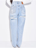Jeans coupe droite stretchy effet destroy  & strass sur l'arrière