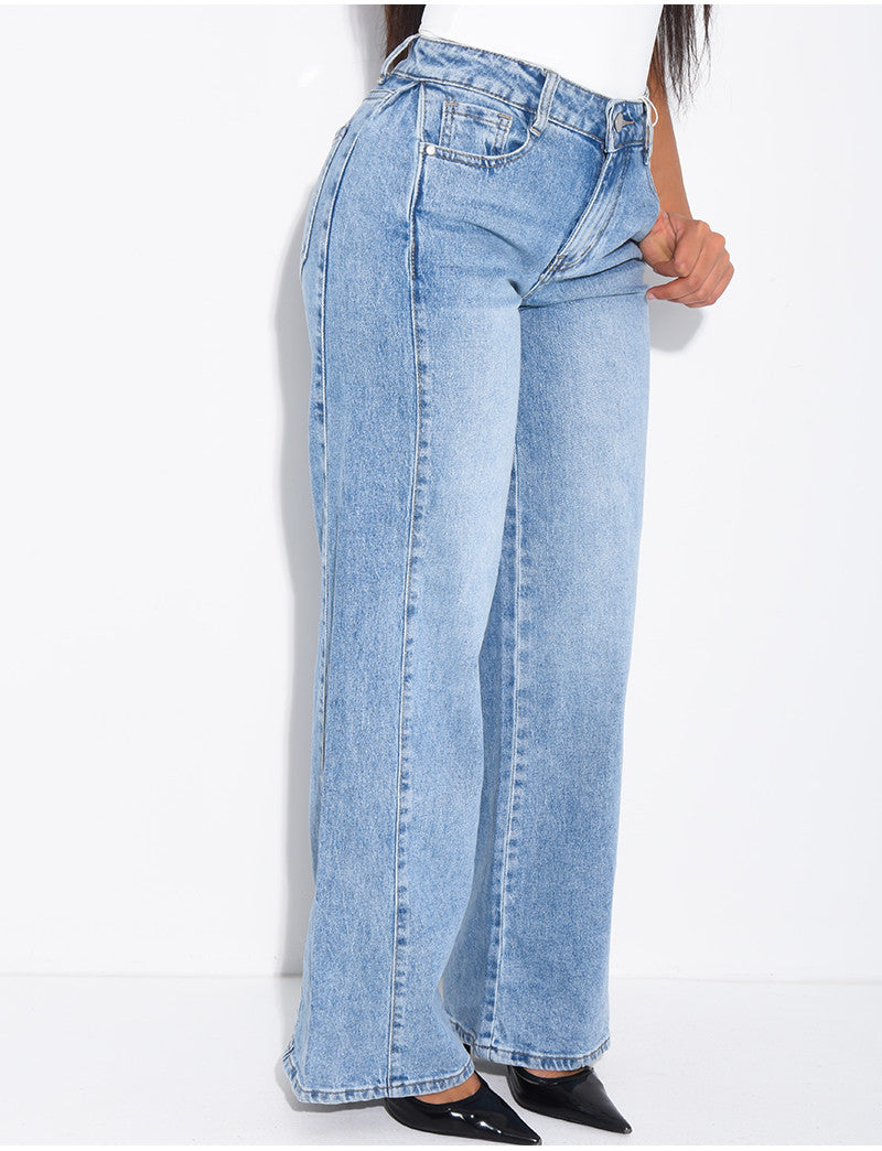 Jeans délavé à pinces à la taille