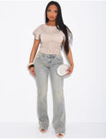 Jeans flare taille basse à délavage vintage