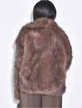 Veste courte en fausse fourrure