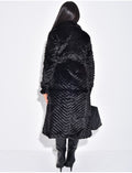 Manteau long en fausse fourrure effet chevron