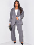 Pantalon de tailleur taille haute effet bouffant