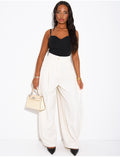 Pantalon de tailleur bouffant à boutons aux chevilles