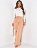 Pantalon coupe droite à boutons dorés