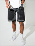 Short en jeans à empiècements contrastants & tâches de peinture