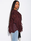 Blouse en voile transparent à volants