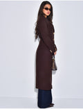 Manteau très cintré à boutons dorés