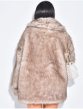 Manteau mi long en fausse fourrure